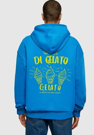 Blue hoodie featuring yellow print of ice cream cones with decorative lines. Long sleeves, relaxed fit, and a hood. Casual style.