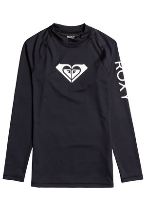 Svart langermet rash guard laget av stretchy stoff, med et hvitt hjerte-logo på brystet og "ROXY" tekst langs venstre erme.