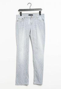 Ljusblå denimjeans med rak benmodell, som har fem fickor, subtil blekning och detaljstikningar. Hänger på en svart galge.