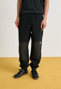 The North Face M RETRO DENALI PANT - Tracksuit bottoms - black