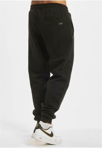 Roberto Cavalli Junior ROCAWEAR DUNCAN - Trainingsbroek - black