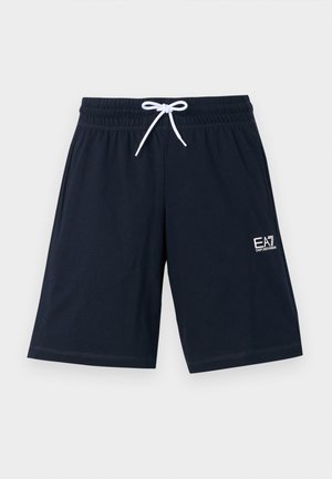 Tums zilas šorti, izgatavoti no mīkstas auduma, ar elastīgu jostu un baltu saišu. Iekļauta maza balta logo zem labās puses.