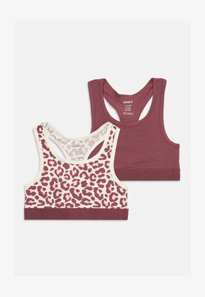 Deux brassières de sport sans manches, une unie bordeaux et une avec un imprimé léopard bordeaux sur fond blanc, toutes deux avec un dos nageur, posées à plat sur un fond blanc.