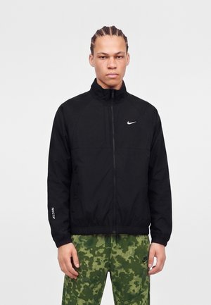 Nike Sportswear, NOCTA - Тренировъчно яке - black/white