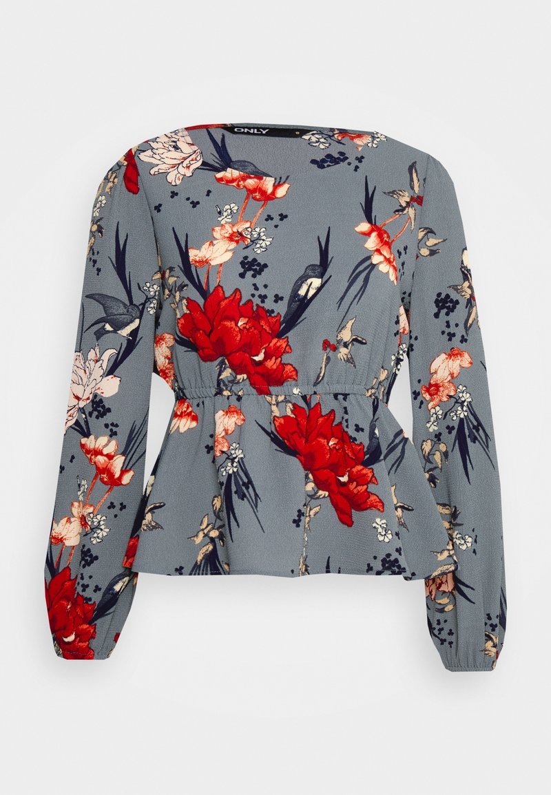 Blouse grise à manches longues avec imprimé floral rouge et blanc et détail élastique à la taille.