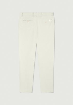 White trousers with a tailored fit, featuring a smooth texture, side and back pockets, and a subtle logo accent on the rear.