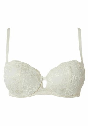 Lace bra in ivory with padded cups, a center cutout, adjustable straps, and a smooth back band. Features floral lace detailing.