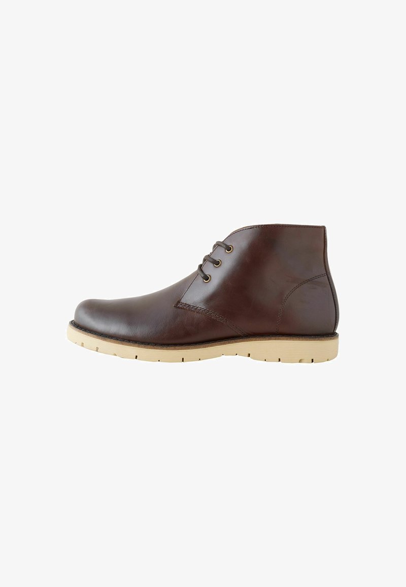 Brown leather ankle boots with a smooth finish, featuring two eyelet lacing, a rounded toe, and light rubber soles with traction grooves.