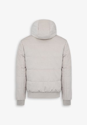 Doudoune beige clair avec une capuche ajustée. Caractéristiques d'un motif matelassé horizontal, de poignets et d'ourlet côtelés pour plus de chaleur.
