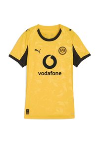 Maglia sportiva gialla con accenti neri. Presenta un design floreale e un logo centrale. Realizzata in materiale sintetico con maniche corte.