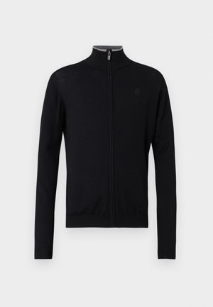 Crna zip-up dukserica s visokim ovratnikom, izrađena od glatkog materijala. Ima duge rukave te rebraste manžete i donji rub. Suptilan logo detalj na prsima.