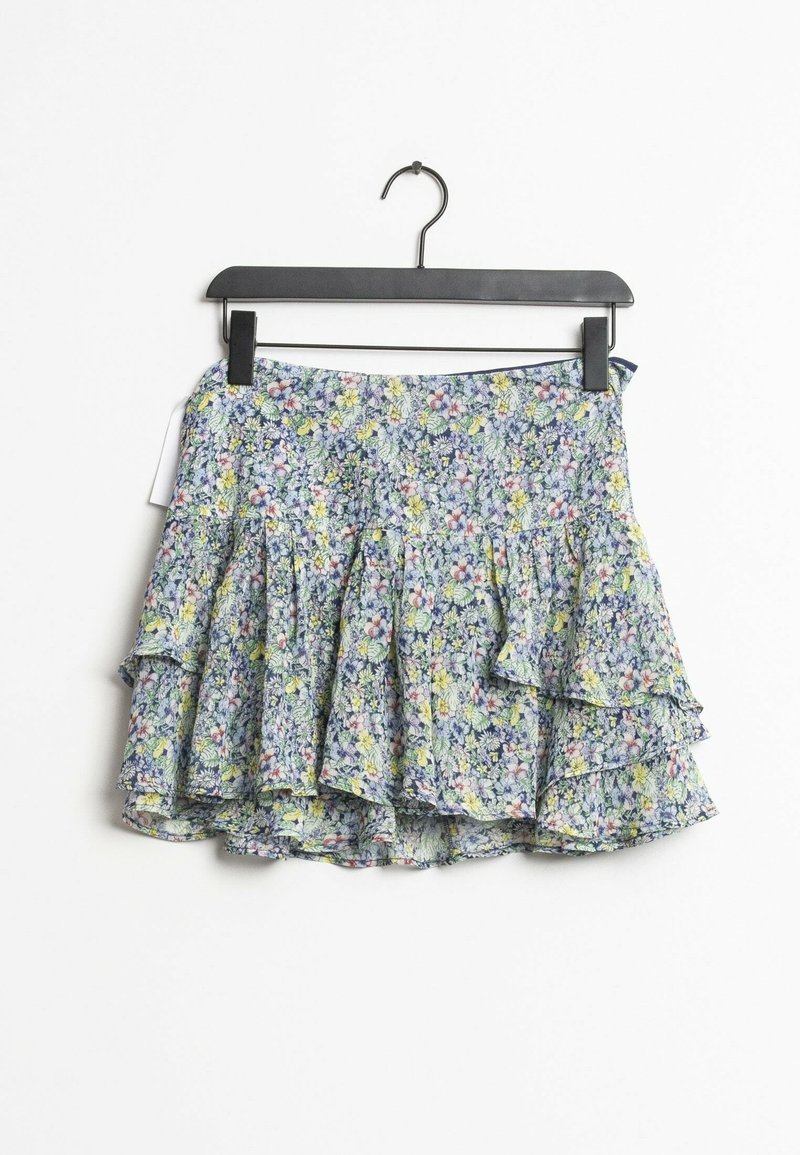 Floral-patterned layered mini skirt in blue, yellow, and white hangs on a black hanger against a white background.
