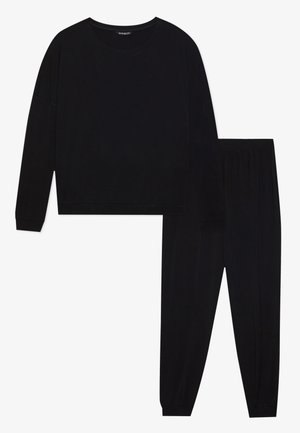 Conjunto de ropa de estar por casa en negro que incluye una camiseta de manga larga con cuello redondo y corte holgado, combinado con pantalones ajustados a juego que cuentan con una cinturilla elástica.