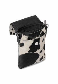 Cowhide pouch with a black and white spotted pattern, featuring a zippered opening and a snap button closure. Textured surface with detachable strap.