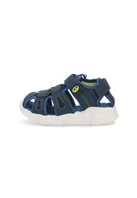 Sandalias infantiles de color azul marino con correas ajustables, con un diseño deportivo y suelas blancas, ideales para actividades de verano.