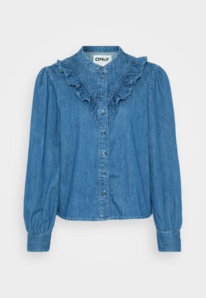 Denim skjorte med knappestolpe og volangkrage, lange ermer, i mellom blå farge med perlemorsknapper foran.
