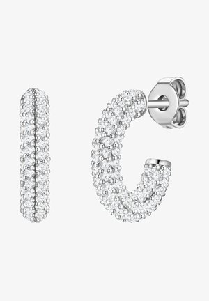 Hõbedast rõngaskõrvarõngad tekstuurse pinnaga, mis on kaunistatud paljude väikeste kristallidega. Üks kõrvarõngas on sirge joon, teine on kaardus vorm.