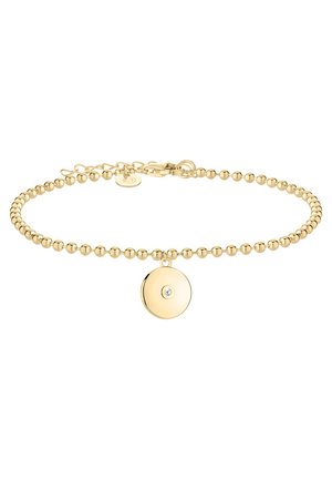 Złota bransoletka z koralikami, regulowanym zapięciem oraz okrągłą złotą zawieszką z małym, przezroczystym kamieniem w centrum.