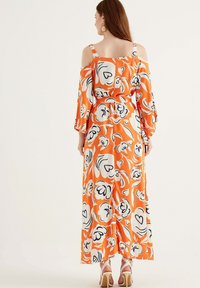 Herita Maxikjoler - orange