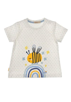 White baby t-shirt with light blue polka dots, featuring a smiling yellow bee above a blue and yellow rainbow with small flowers.