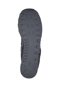 Grau gummierte Schuhsohle mit einem strukturierten Traktionsmuster, erhöhten Elementen, abgerundeten Kanten und einem leichten Bogen für Unterstützung.