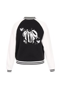 Zwart-wit bomberjack met raglanmouwen, geborduurde vlinder- en bloemenmotief op de achterkant en gestreepte boorden.