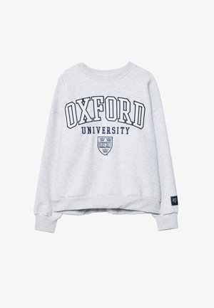 Svetlošedý sweatshirt s textom "OXFORD UNIVERSITY" a univerzitným erbom potlačeným námorníckou modrou farbou na prednej strane, s rebrovanými manžetami a lemom.