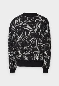 Black sweatshirt with an abstract white pattern, ribbed round neckline and cuffs, and a visible logo on the bottom right side.