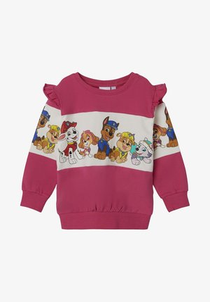 Sweat-shirt rose à manches longues pour enfants avec épaules volantées, avec une bande de personnages de Paw Patrol en uniformes bleu, jaune, rouge et blanc.