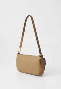 Tan leather shoulder bag with a textured surface, curved shape, and a detachable strap. Features gold hardware accents for closure.
