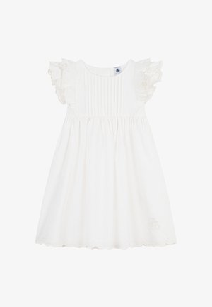 Λευκό βαμβακερό φόρεμα με κοντά μανίκια με βολάν, σφηκοειδές μπούστο, ροή φούστας και κυματιστό τελείωμα. Διαθέτει διακριτικές κεντητές λεπτομέρειες.