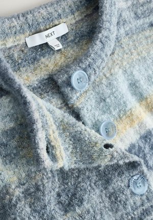 Knit sweater in blue and grey tones with a soft, textured finish. Features a collar and light blue plastic buttons. Brand label visible.