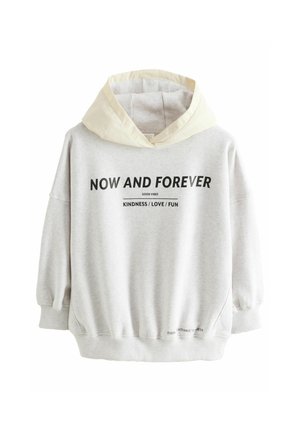 Sweatshirt gris clair avec capuche crème, affichant le texte noir "MAINTENANT ET POUR TOUJOURS", coupe décontractée, poignets et ourlet élastiques. Le texte comprend des phrases positives.
