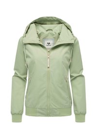 Jasnozielona kurtka przeciwwiatrowa z kapturem, z zamkiem błyskawicznym z przodu i elastycznymi mankietami. Posiada sznurki do regulacji oraz dwie boczne kieszenie. Gładka, matowa tekstura.