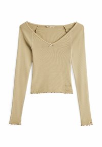 Beige Langarmoberteil aus geripptem Stoff, mit weiter Ausschnitt, rohem Saum und einer kleinen Schleifenakzent am Hals.