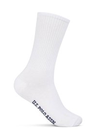 White crew sock with ribbed upper and "U.S. POLO ASSN" text printed in black near the toe area.