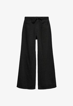 Svarta vida byxor i bomullstyg, med dragsnöre i midjan, framskjutna fickor och en mjuk yta.