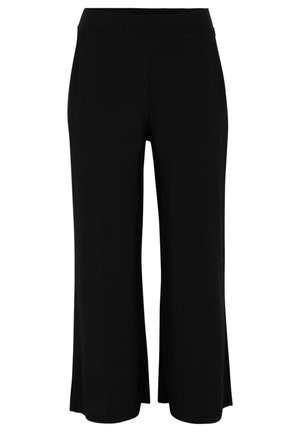 Schwarze weit geschnittene Hose aus weichem Stoff mit einem elastischen Bund, die eine glatte Textur und ein lockeres, fließendes Design aufweist.