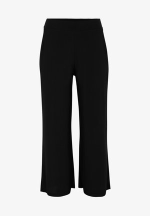 Schwarze weit geschnittene Hose aus weichem Stoff mit einem elastischen Bund, die eine glatte Textur und ein lockeres, fließendes Design aufweist.