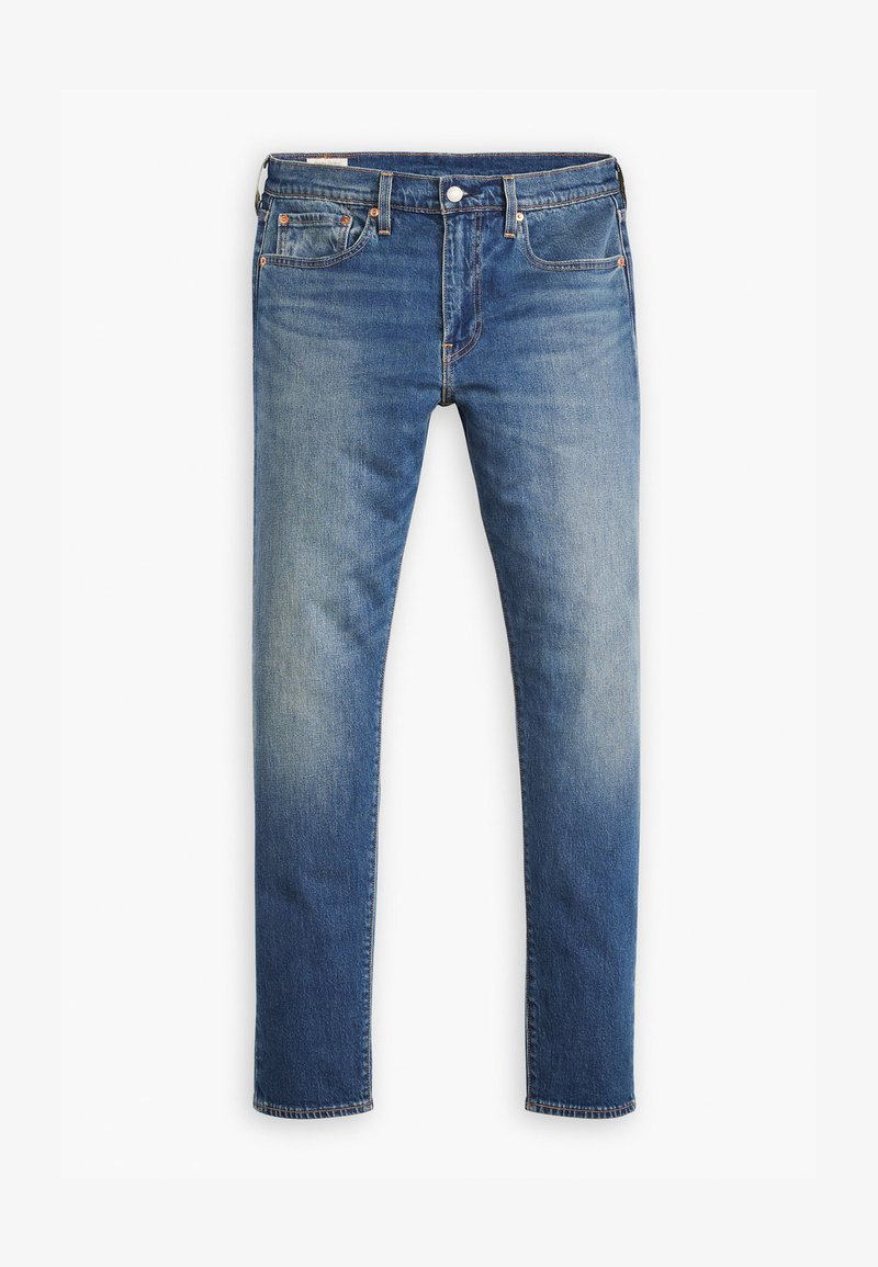 Schmale Jeans aus mittelblauem Denim mit verblassten Bereichen, Fünf-Taschen-Design, Metallknopfverschluss und sichtbaren Nähakzenten.