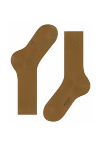 Brązowe skarpetki do kostek wykonane z gładkiego materiału, z prążkowanymi mankietami i nadrukowanym logo na podeszwie, zaprojektowane z myślą o komforcie i trwałości.