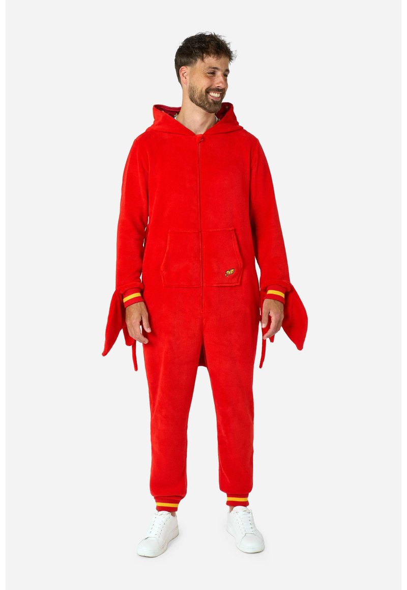 Red fleece onesie with a hood, front zipper, and side pockets. Features contrasting yellow and red striped cuffs and fabric texture.