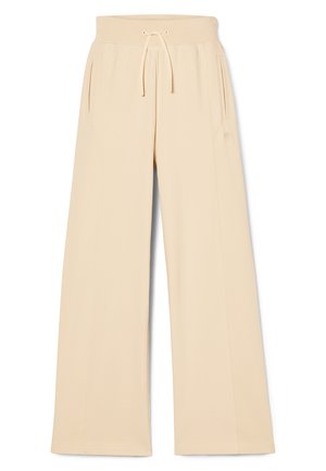 Pantalones de chándal de pierna ancha en color beige con cinturilla elástica, cierre de cordón y bolsillos laterales. Tejido suave con detalle del logo en la pierna izquierda.