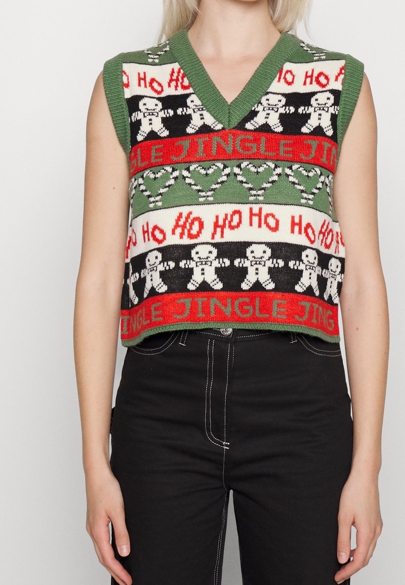 Grünes, gestricktes ärmelloses Weste mit einem V-Ausschnitt, festlichen Mustern von Lebkuchenfiguren, "Jingle" und "Ho Ho Ho" in Rot und Schwarz.