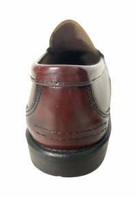 Brown leather shoe, rounded back, visible stitching detail, a smooth surface, and a black rubber sole. Simple design, no embellishments.