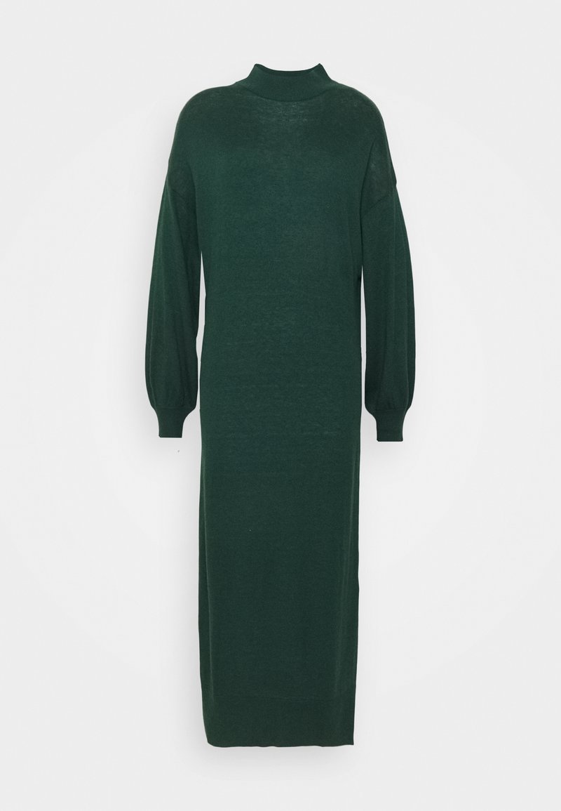 Longue robe en maille vert foncé avec un col montant et de longues manches bouffantes avec des poignets ajustés.