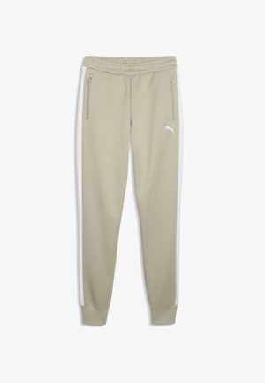 Beżowe spodnie dresowe Puma z elastycznym pasem, kieszeniami bocznymi na zamek, białymi paskami na nogawkach oraz logo Puma na górnej lewej uda.