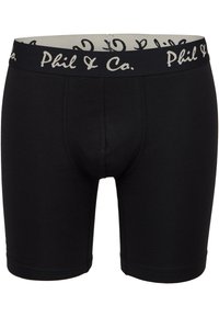 Bóxers negros hechos de tela elástica, con una banda elástica que presenta "Phil & Co." en un color contrastante y un diseño ajustado.