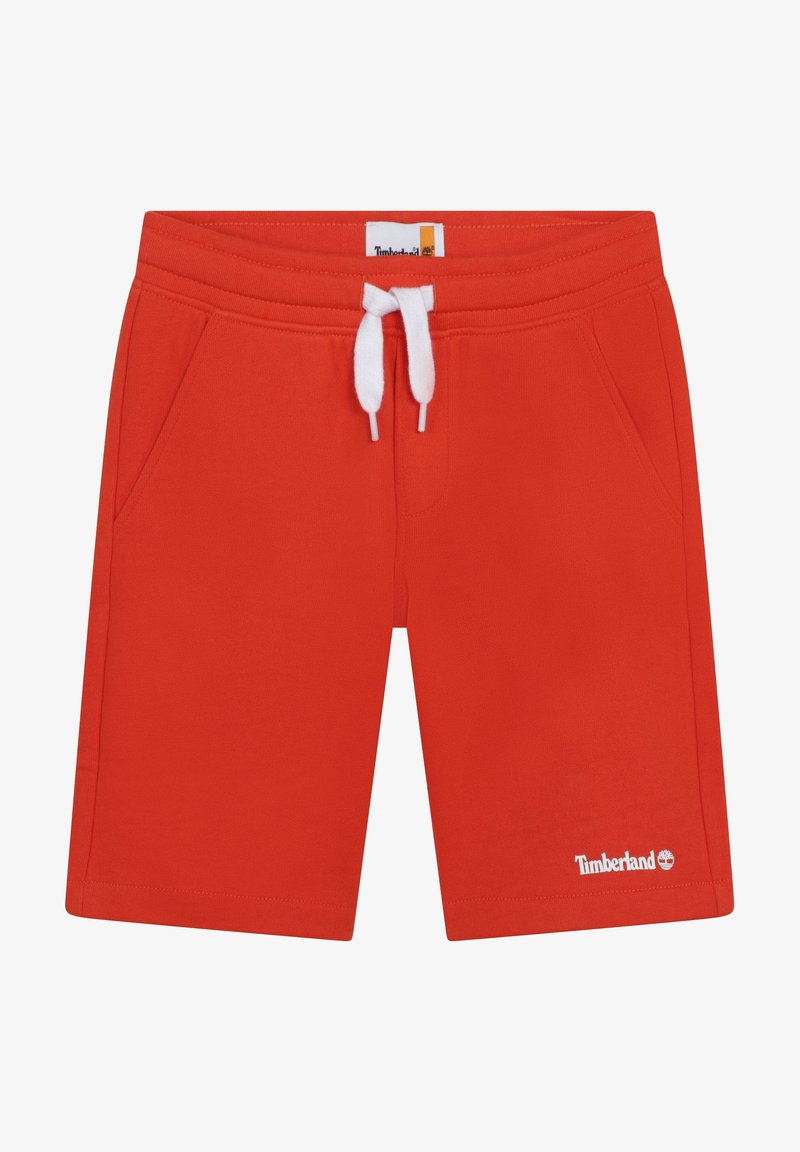 Shorts rouges Timberland avec taille à cordon blanc et poches latérales, logo Timberland sur l'ourlet de la jambe gauche.