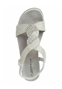 Silver beaded sandal with a twisted strap design and soft suede-like upper. Closed back with a braided elastic heel strap. Flat sole.